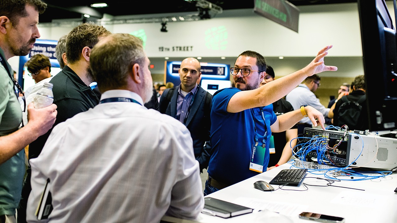 Engineers exploring a hands-on technology demonstration at NI Connect.