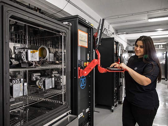 An engineer tests autonomous vehicle systems in a lab