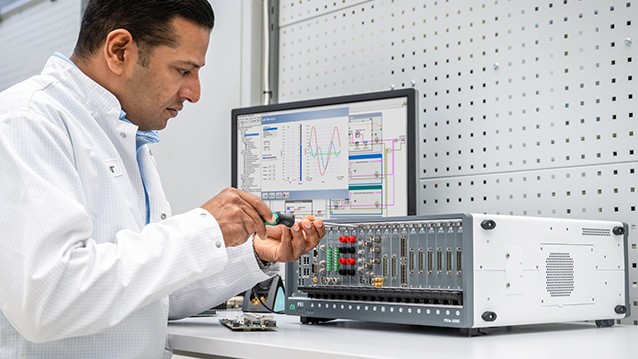 Engineer in lab working on PXIe-1095
