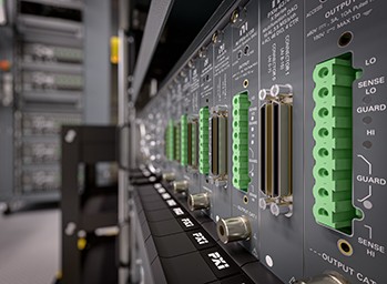 A PXI chassis filled with DC, analog, and digital instrumentation