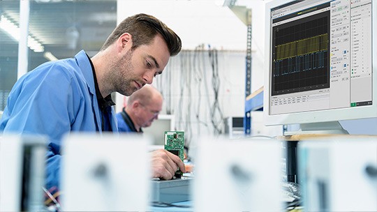 Engineer taking measurements in a lab
