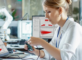 engineer in a lab testing a device