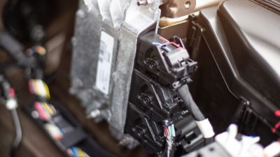 Alma Automotive HIL test bench showing an NI PXI system connected to engine throttle bodies and ECU hardware for real-time embedded software validation.