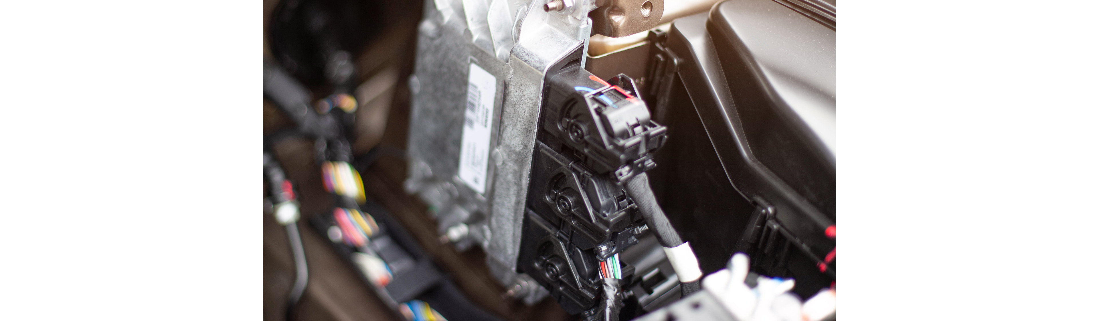 Alma Automotive HIL test bench showing an NI PXI system connected to engine throttle bodies and ECU hardware for real-time embedded software validation.
