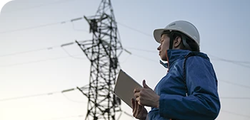 engineer in front of a transformer