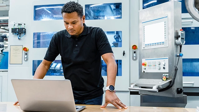 Engineer managing a fleet of tests using a laptop​ 