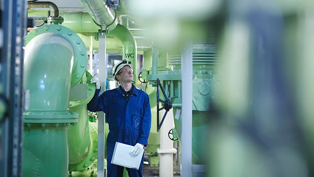 engineer inspecting pipes