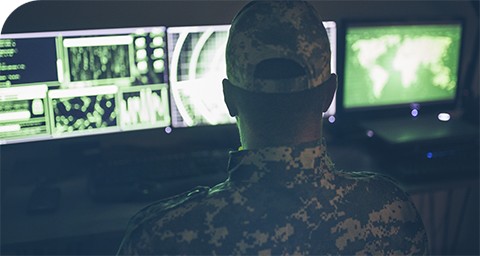 military servicemember monitoring computer screens