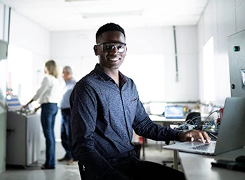 A test engineer in a laboratory evaluates the conditions under which a device will fail.