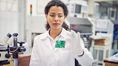 engineer inspecting circuit board