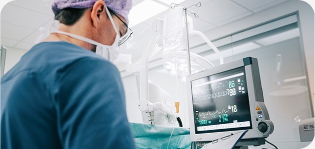 Doctor looking at medical device screen