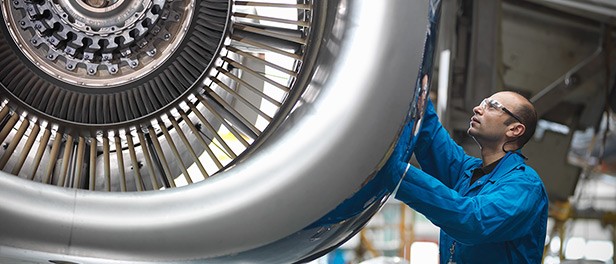 Engineer working on a turbine engine