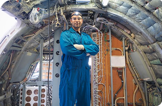 engineer standing inside aircraft
