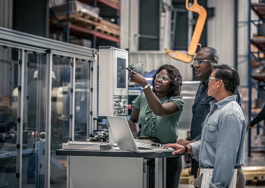 engineers monitoring machine performance