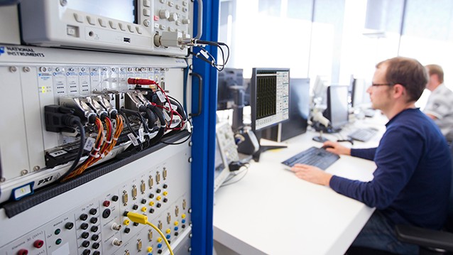 Engineer using InstrumentStudio software in a test lab