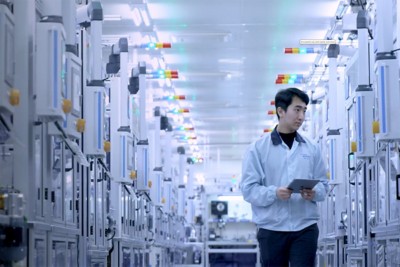 Hyundai Kefico employee walks through production facility​