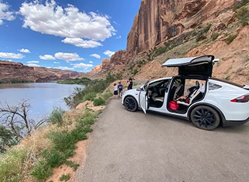 Autonomous vehicle powered by ProAI is parked next to seawall