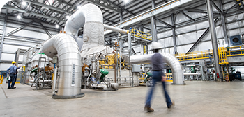 several engineers monitoring a power plant