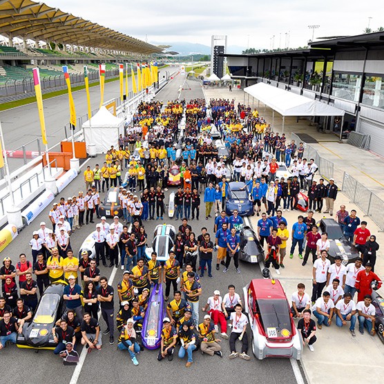 Teams of drivers, engineers, and their race cars made from sustainable materials after the Shell Eco-marathon.