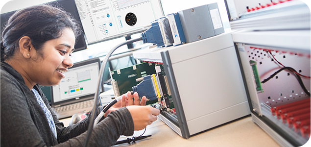 An engineer running a hardware in the loop (HIL) simulation