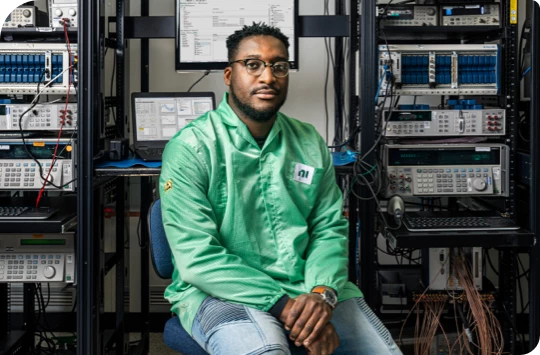 ni engineer surrounded by test equipment