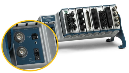 The close-up shows the power input, BNC trigger lines, and locking USB port on the cDAQ-9178