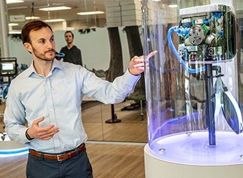 An engineer pointing at medical device equipment