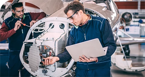 engineers examining radar components