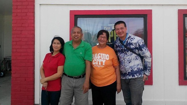 The Restaurant Owners Filipino Posing with a GP Engineer